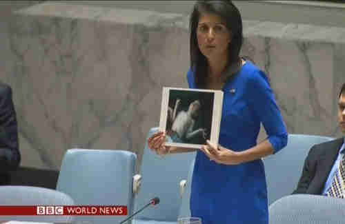 In a very dramatic gesture, US Ambassador to the UN Nikki Haley at the Security Council stands and displays picture of baby killed by nerve gas and excoriates Russia's ambassador for supporting al-Assad, saying, 'How many more children have to die before Russia cares?'