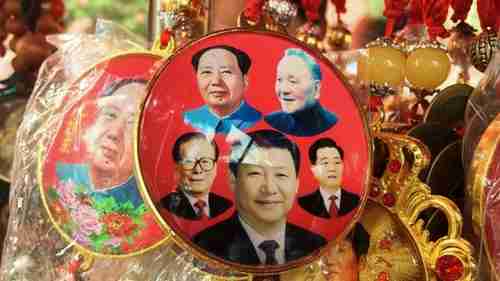 Chinese souvenir badge with pictures of Mao Zedong, Deng Xiaoping, Jiang Zemin, Xi Jinping, and Hu Jintao (AFP)