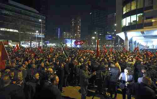 Demonstrators outside the Turkish consulate in Rotterdam on Saturday evening (Reuters)