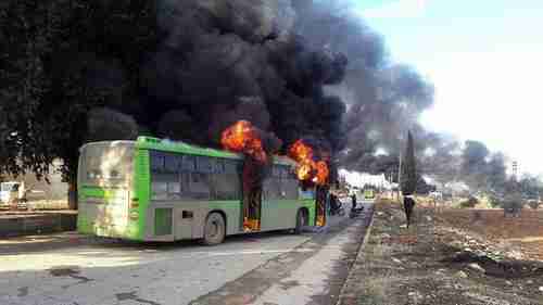 A bus burning during the attack. The passengers were still in their seats as the bus burned. (ARA News)