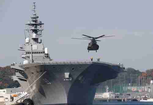A helicopter lands on the decks of the JS Izumo (Reuters)