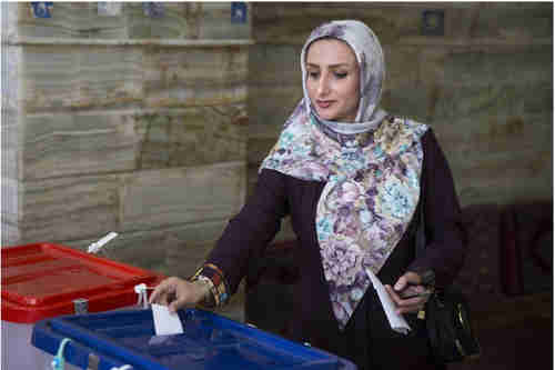 Young woman voting in Iran on Friday