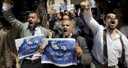 Dozens of Egyptian lawyers shout slogans during a protest in front of the Lawyers' Syndicate in Cairo against the agreement to hand over Tiran and Sanafir to Saudi Arabia. (AP)