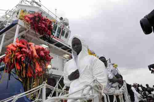 Migrants from Africa arrive in Italy on a rescue ship