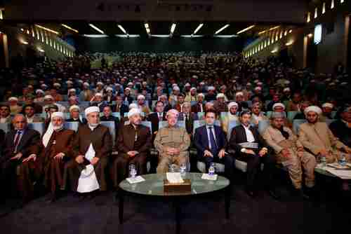 Iraqi Kurdish leader Massoud Barzani (C) sits during his meeting with clerics and elders in Erbil last month (Reuters)