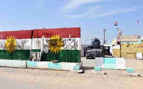 Defaced Kurdistan flags at a former Peshmerga position now held by Iraqi forces on Friday (AFP)