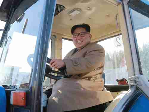 The gargantuan Kim Jong-un inspects a tractor factory last week (AFP)