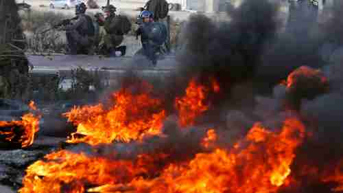 Israeli troops clash with Palestinian demonstrators in Ramallah on Thursday (Sky News)