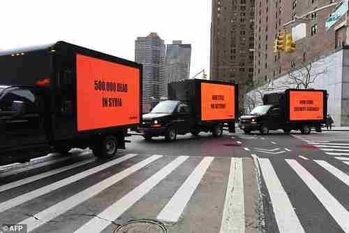 Inspired by the Oscar-nominated film 'Three Billboards Outside Ebbing, Missouri,' three billboards circle the United Nations on Thursday for three hours to demand action on Syria from the Security Council (AFP)