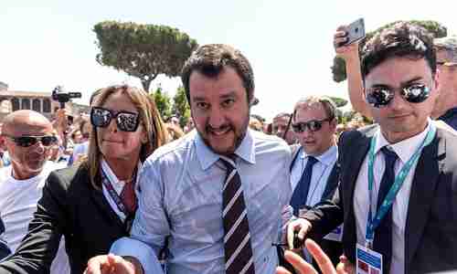  Italy's new interior minister Matteo Salvini (center) savors his victory