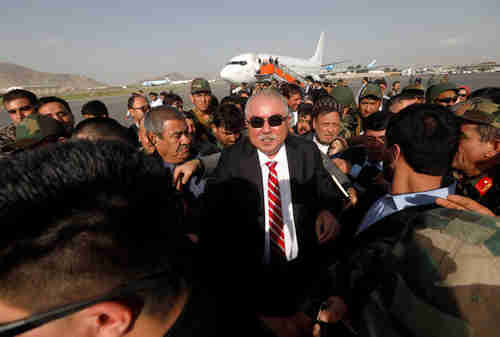 Gen. Abdul Rashid Dostum, Afghan vice president and Uzbek warlord, arrives in Kabul on Sunday, greeted by hundreds of supporters (Reuters)