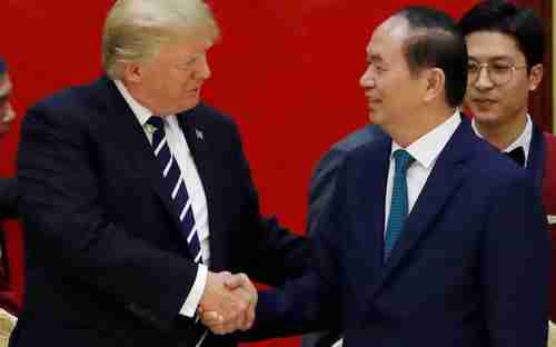 Donald Trump meets Vietnam's leader Tran Dai Quang in Hanoi last year (Reuters)