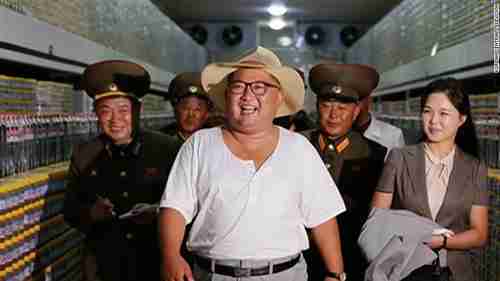 North Korea's child dictator Kim Jong-un in a tee shirt, frolicking with his wife Ri Sol-ju and his army generals