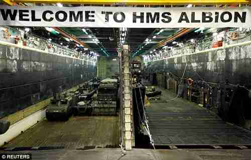 Military vehicles in the loading dock of the HMS Albion (Reuters)