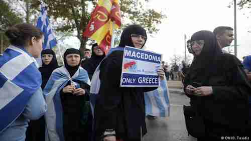 Greek Orthodox nuns holding Greek and Byzantine flags protest the Macedonia name deal. (Deutsche Welle)