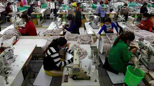 Employees at Cambodian clothes factory whose business is benefiting from EU trade preferences (Reuters)