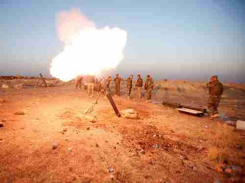 Kurdish Peshmerga forces fire a mortar towards ISIS positions near Mosul in 2016. These forces are now turning against Iran. (Reuters)