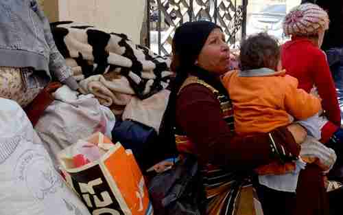 Coptic Christian families from El-Arish arriving at the Evangelical Church in Ismailia last week (Reuters)