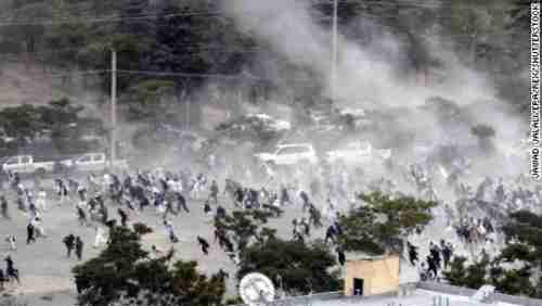 Mourners in Kabul run for safety Saturday after an explosion at a funeral (CNN)