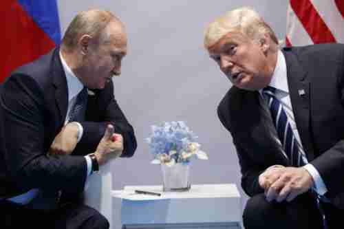 Vladimir Putin and Donald Trump meeting at the G20 summit in Hamburg on Friday (AP)