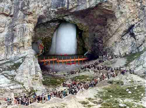 Long lines of pilgrims visiting the Amarnath shrine in 2016. Inside the 40 m (130 ft) high cave, water drops from melting snow fall from the roof of the cave to the floor, creating a stalagmite that grows upward.