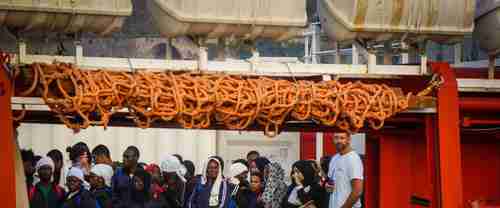 Migrants wait to disembark after being rescued at sea (AP)