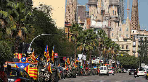 On Friday, hundreds of farmers drove tractors into Barcelona to support the referendum and to protect polling places (Reuters)