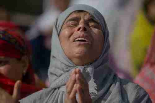 Mohammad Saleem Malik's mother grieves at the funeral for her son on Thursday (AP)